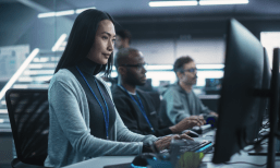Three workers at computers